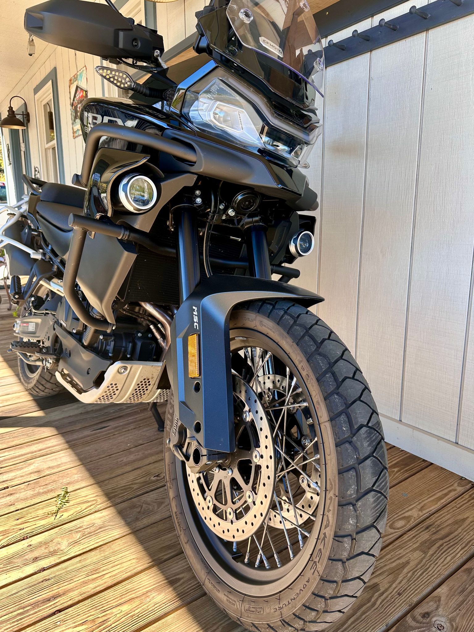 Front three-quarter view with crash bars and auxiliary lights